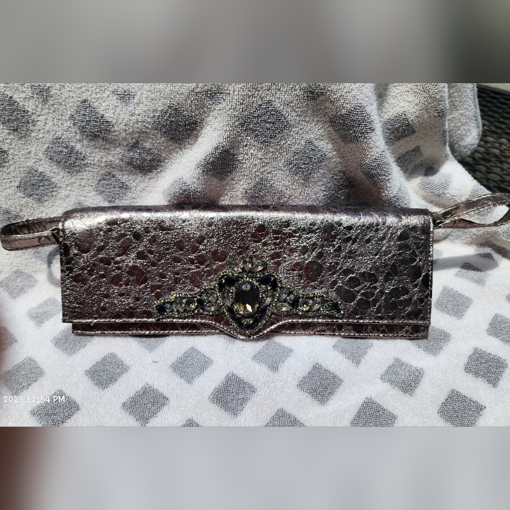 Guess clutch purse. bronze color.